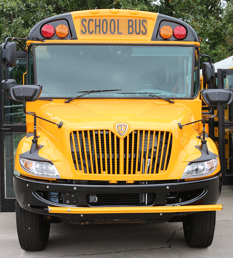 Picture of the front of a Fayetteville Public Schools bus