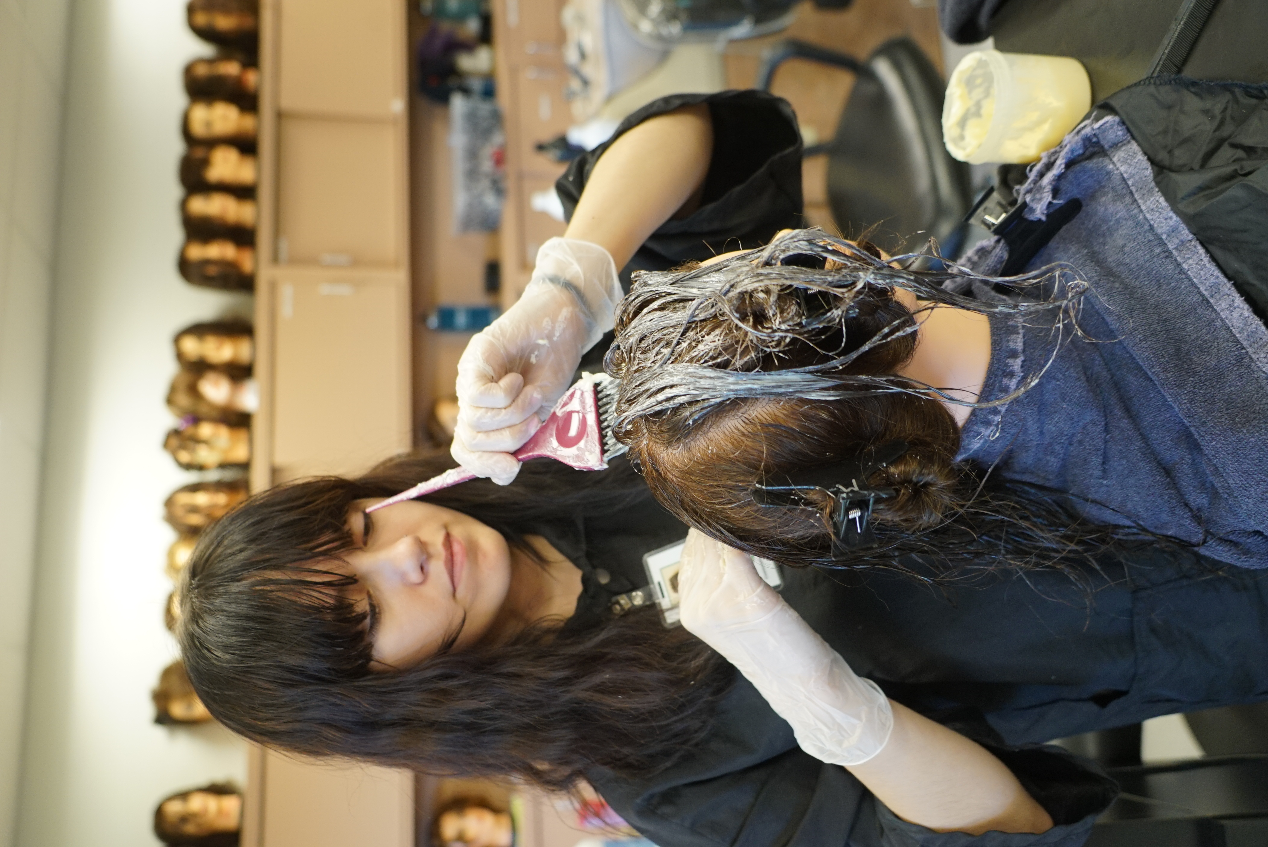 student working on hair 