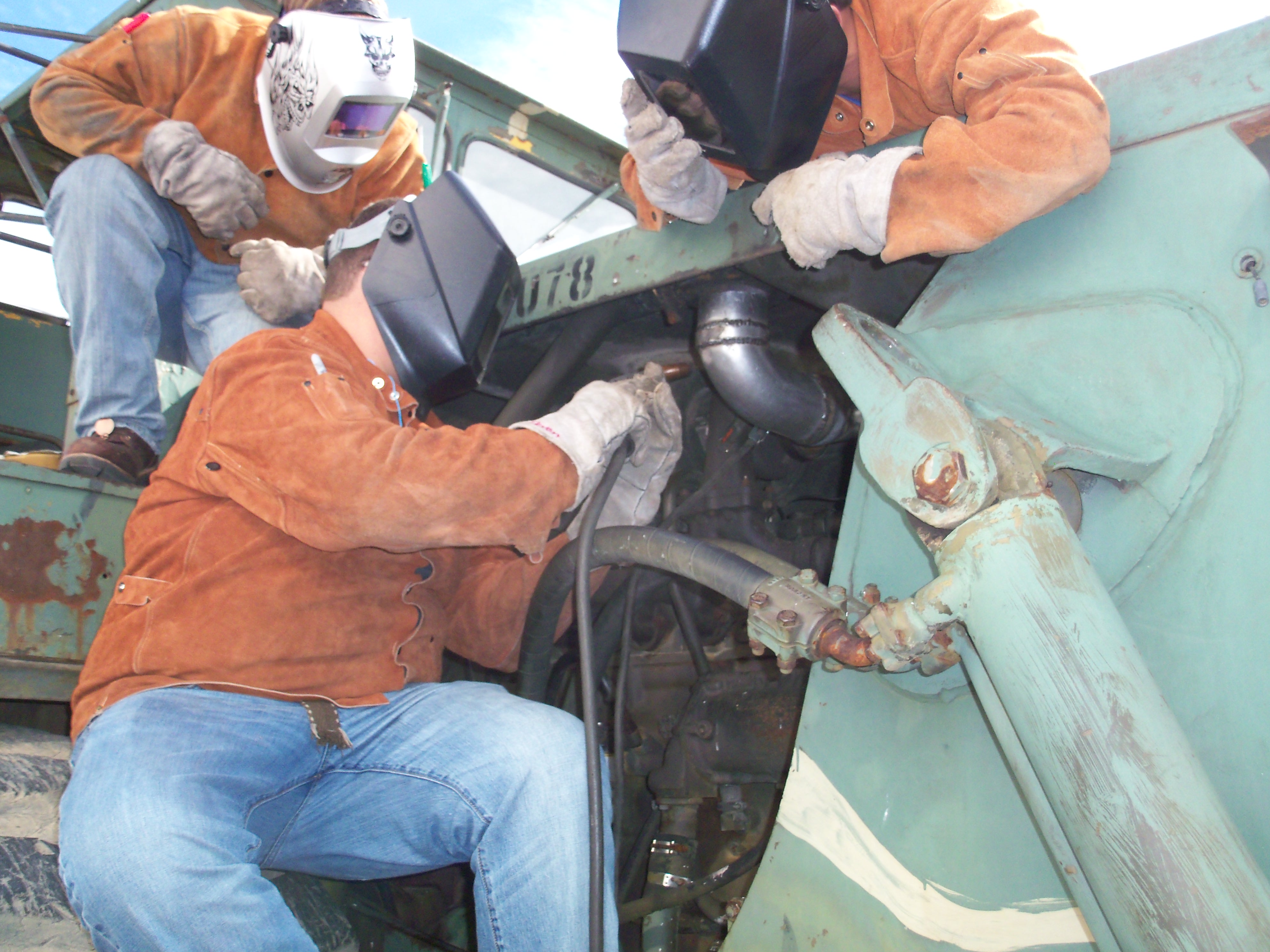 students welding 
